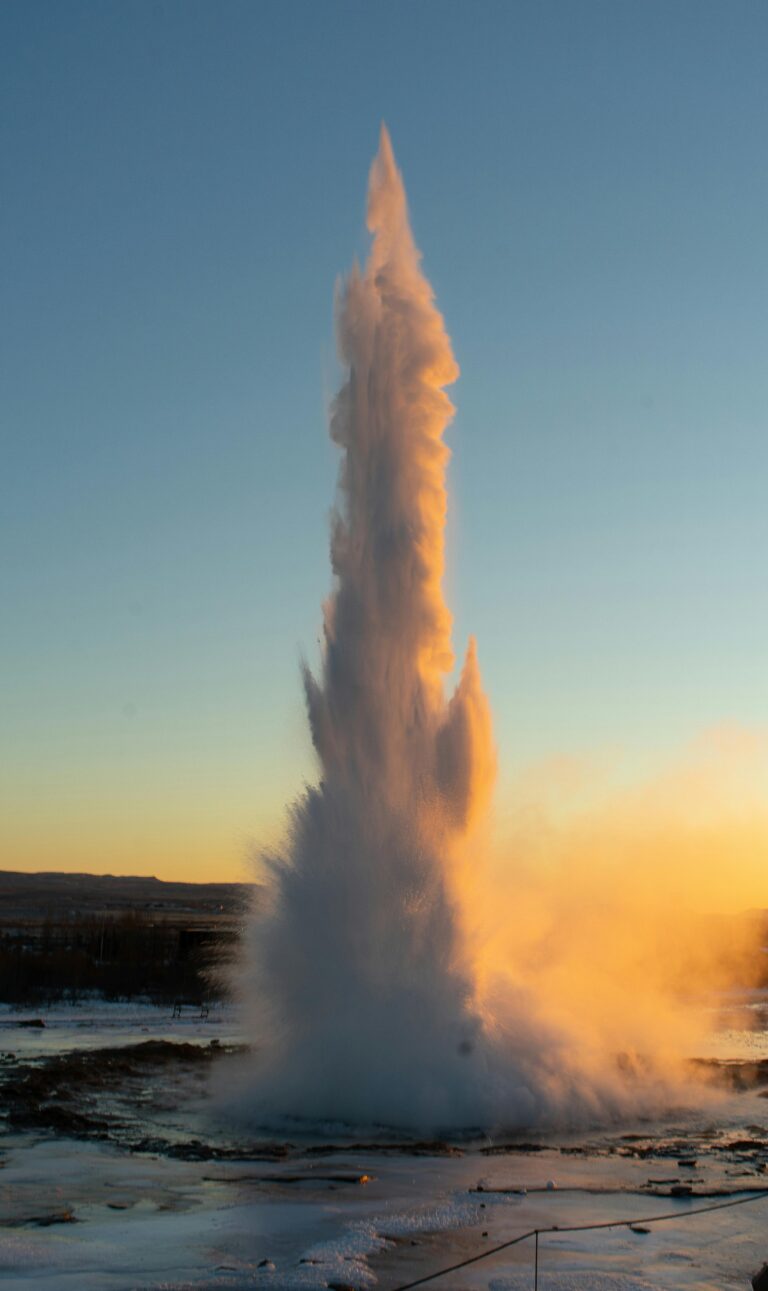 Capture of an erupting geyser in Bláskógabyggð, Iceland at sunset with mesmerizing splashes.